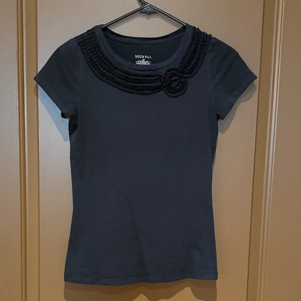 Black blouse with flower accent